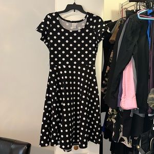 Black dress size medium. Belt not included.